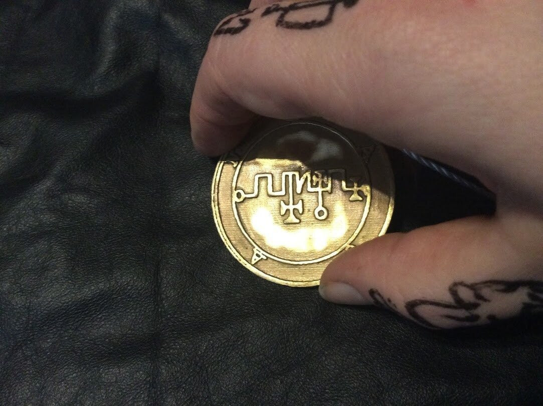 Zagan Goetia ring with raised lettering
